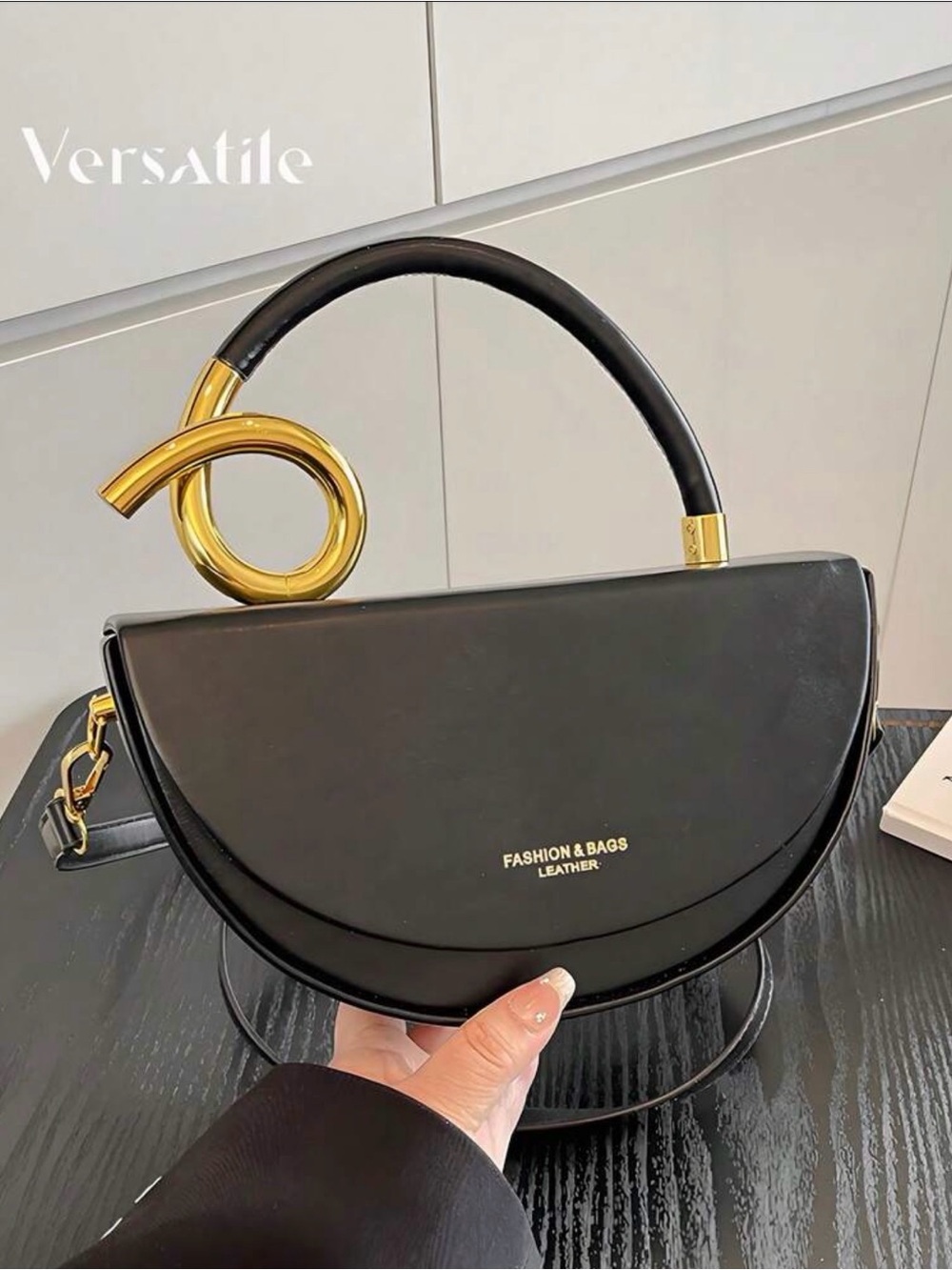 Versatile Black Leather Half-Moon Top-Handle Bag with Gold Accent